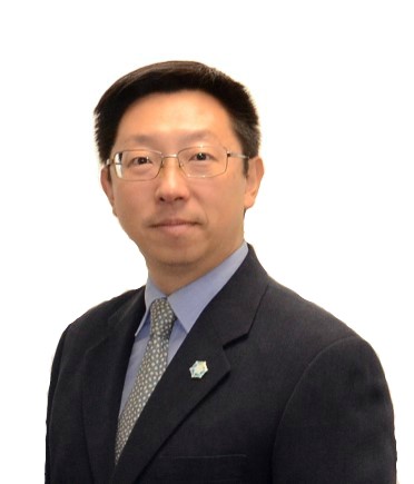 A person wearing glasses and a suit

Description automatically generated with medium confidence