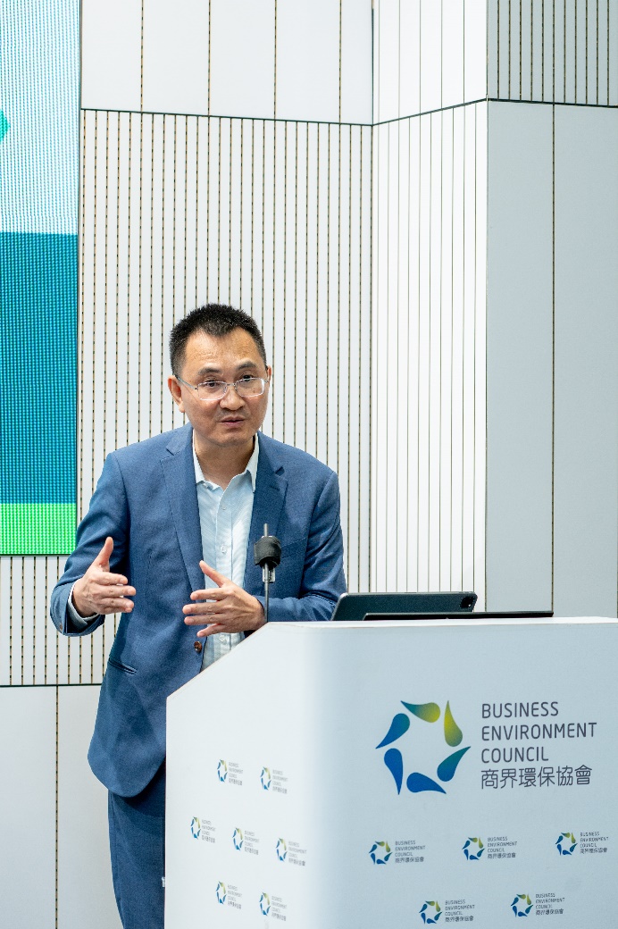 A person standing at a podium

Description automatically generated